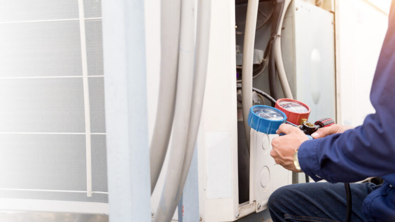Technician Is Checking Air Conditioner ,measuring Equipment For Filling Air Conditioners.