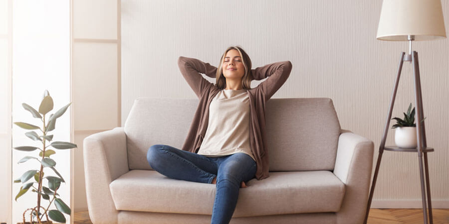woman relaxing on sofa