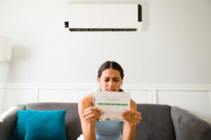 Woman Dealing With High Cooling Costs